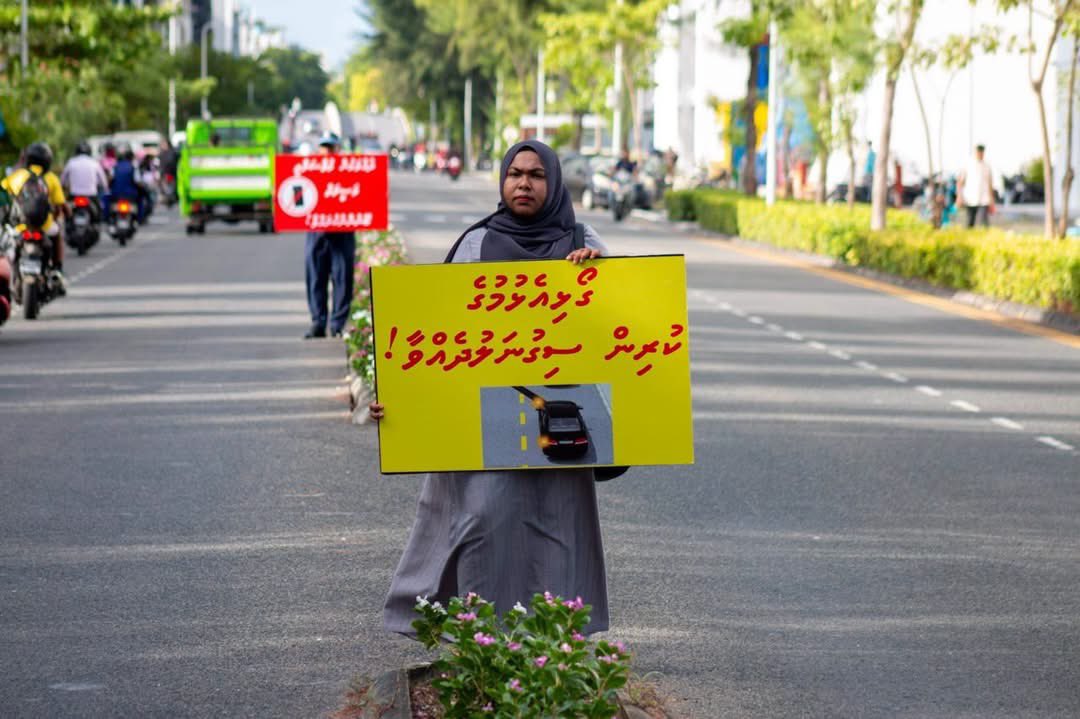 PoliceMv's tweet photo. Our officers from Hulhumale Police conducted a silent campaign to raise awareness about road safety this morning along Nirolhu Magu in Hulhumalé Phase 2.

Using simple yet impactful messages displayed on placards, the officers urged road users to drive safely, remain vigilant, and contribute to accident prevention.

A few seconds of caution can save a life. Let’s work together to make our roads safer. after together.