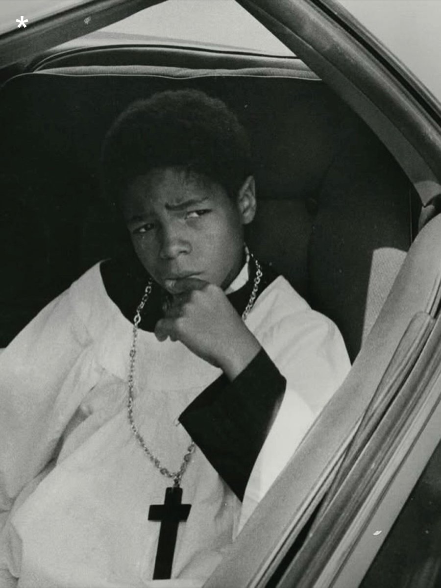 pedestrian's tweet photo. Michael P. Smith captured this image of an altar boy waiting in heavy New Orleans parade traffic in the 70s https://t.co/gb0H5IB0PC