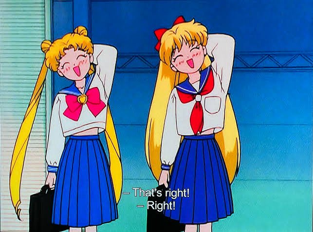 An anime screenshot featuring Sailor Moon and Sailor Venus in school uniforms cheerfully saying 'That's right! Right!'