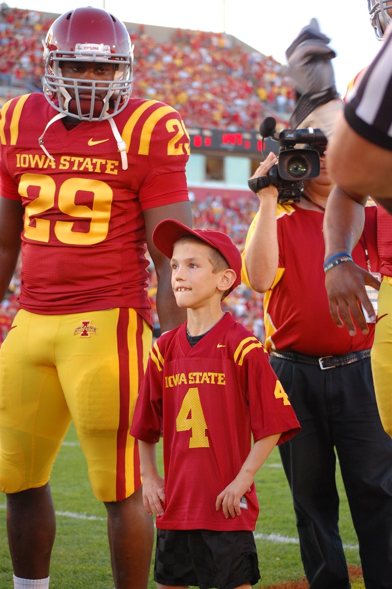 IASTATEAD's tweet photo. Sixteen years ago we played Utah in Jack Trice Stadium.  Coach Rhoads selected our son James as one of his team captains.  James was going through cancer treatments at the time.  Coach Rhoads ultimately created what is now a game day tradition - Having a Kid Captain. https://t.co/ZvyBadXOcI
