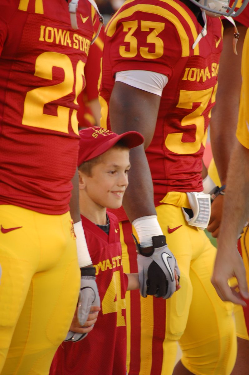 IASTATEAD's tweet photo. Sixteen years ago we played Utah in Jack Trice Stadium.  Coach Rhoads selected our son James as one of his team captains.  James was going through cancer treatments at the time.  Coach Rhoads ultimately created what is now a game day tradition - Having a Kid Captain. https://t.co/ZvyBadXOcI