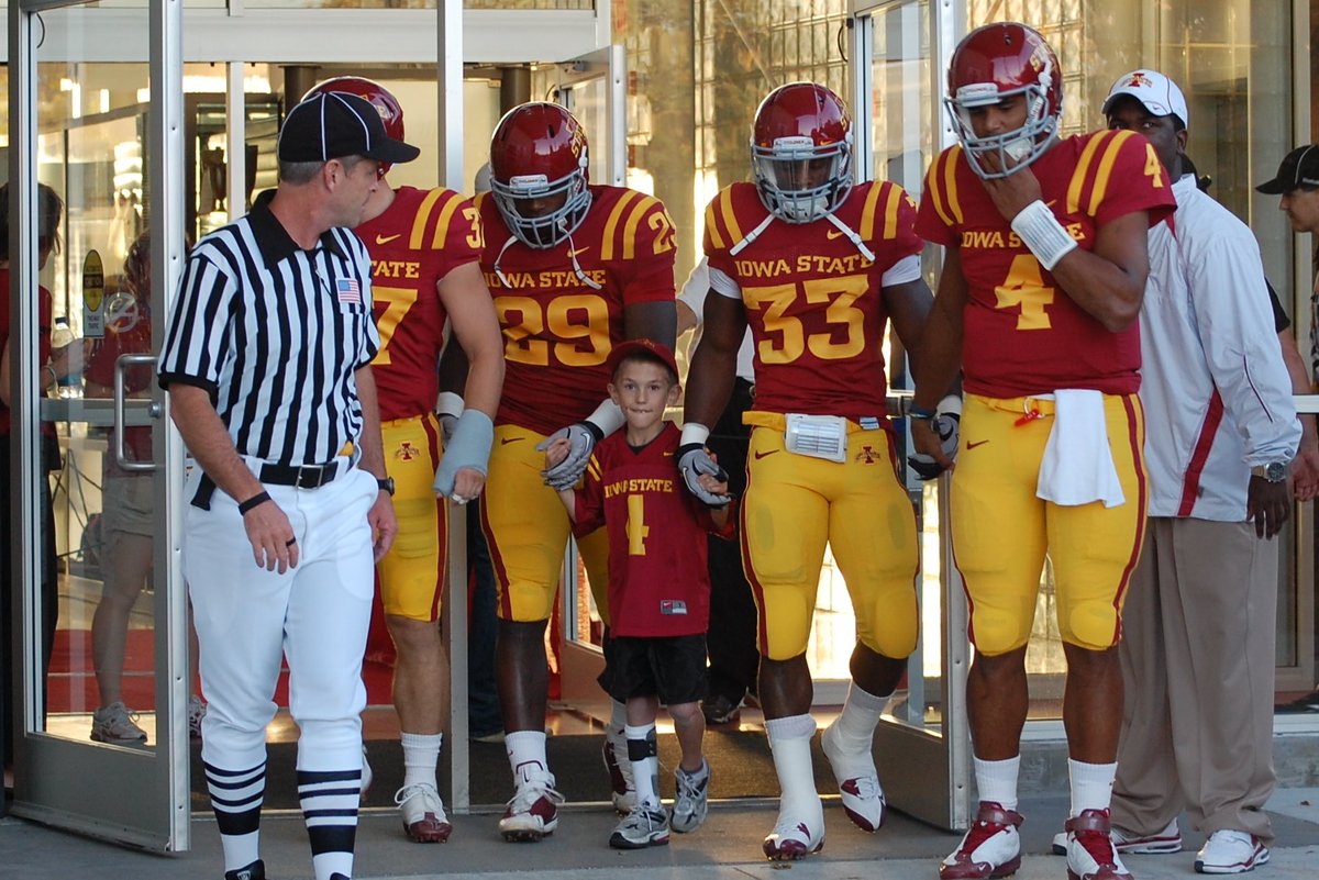 IASTATEAD's tweet photo. Sixteen years ago we played Utah in Jack Trice Stadium.  Coach Rhoads selected our son James as one of his team captains.  James was going through cancer treatments at the time.  Coach Rhoads ultimately created what is now a game day tradition - Having a Kid Captain. https://t.co/ZvyBadXOcI