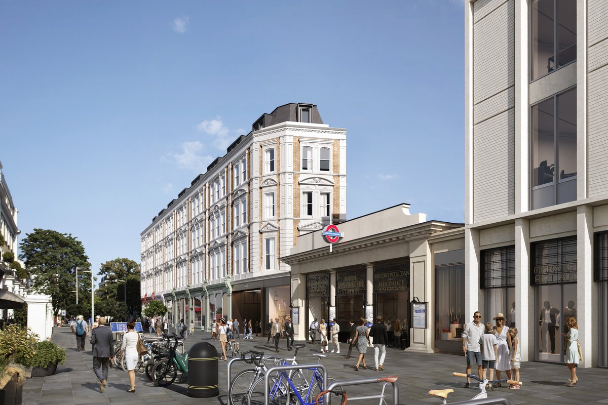 Architectural visualisation of the proposed South Kensington Underground station upgrade, viewed from Thurloe Street looking south-west, showing the redesigned station entrance and forecourt, surrounding historic buildings, pedestrians, bicycles and street furniture.
