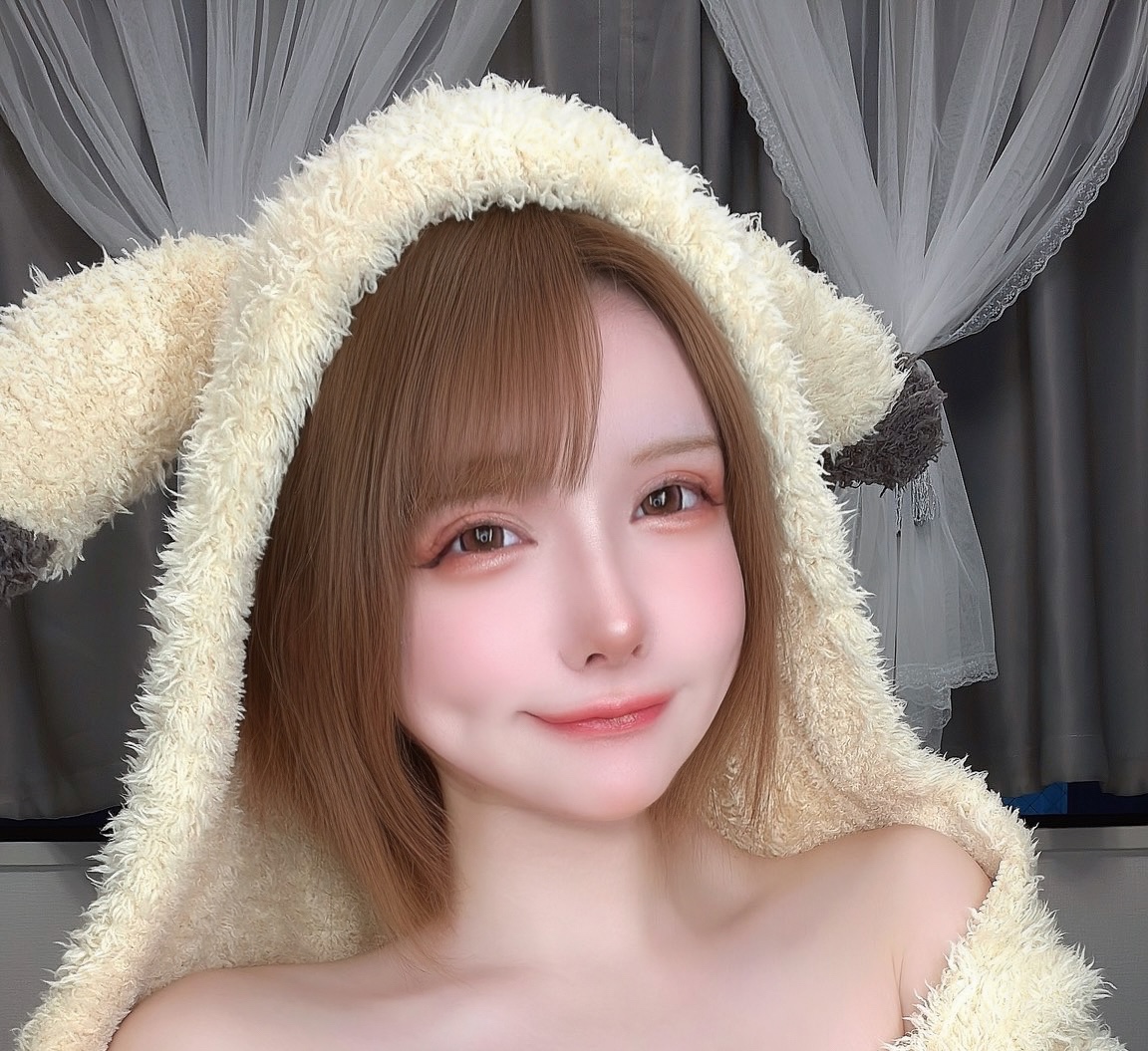 minami yui from singapore in that fluffy bunny-ear hoodie, smiling, face closeup, cosplay gravure