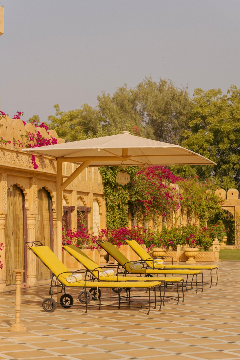 Fort_Rajwada_'s tweet photo. A quieter side of #Jaisalmer.

Where green gardens meet cool waters, and the afternoon asks nothing of you but to stay a little longer.

#Poolside at #FortRajwada, Jaisalmer.

📞 Book Now: +91 97722 09004
🌐 https://t.co/l171e2ltQP

#IncredibleIndia #Rajasthan https://t.co/OJrlJqSfVJ