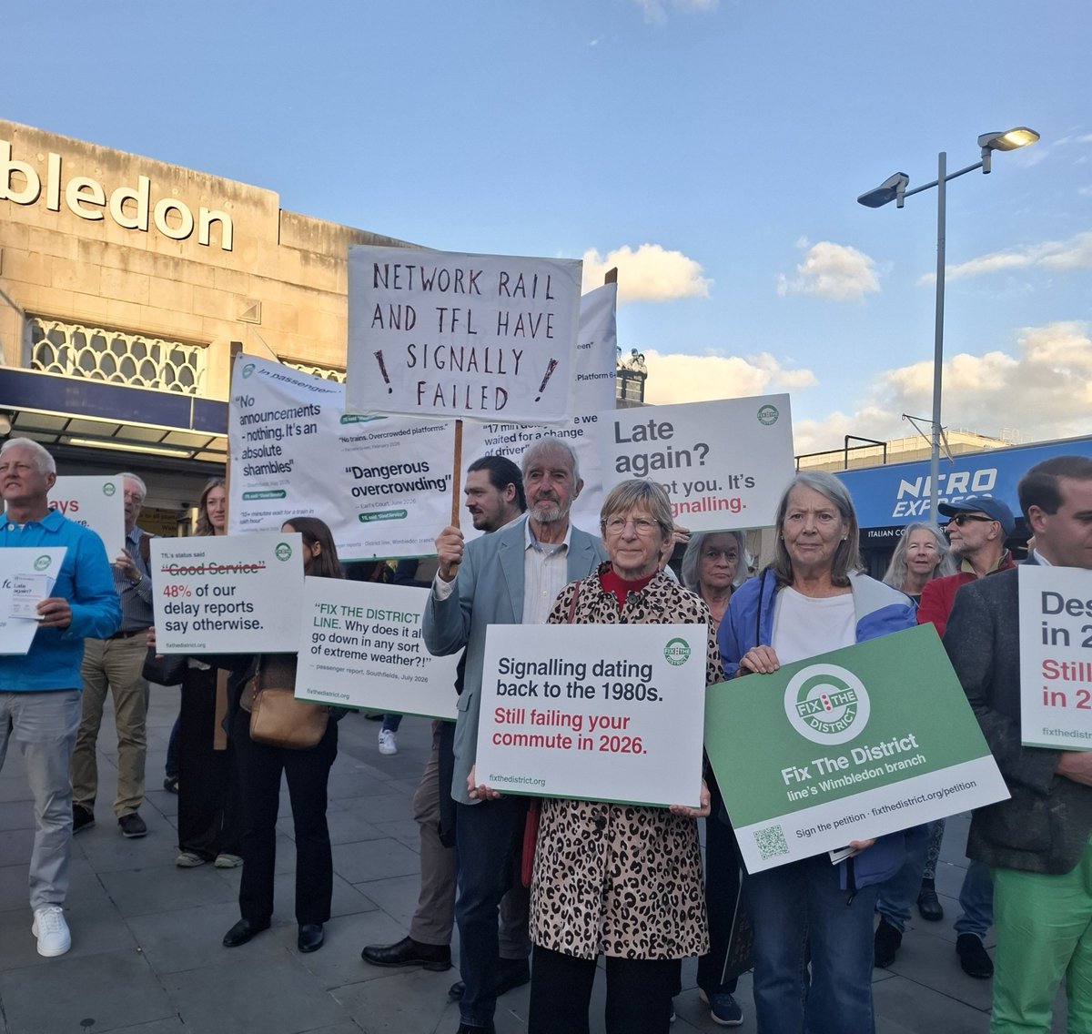 SueWixLD's tweet photo. Good to join @FixTheDistrict0  campaigners tonight. We're calling on the Government to fund modern signalling equipment for the Wimbledon branch of the #DistrictLine 

Please sign ✒️ 
https://t.co/ODRY3327jv https://t.co/K37UXW8txj
