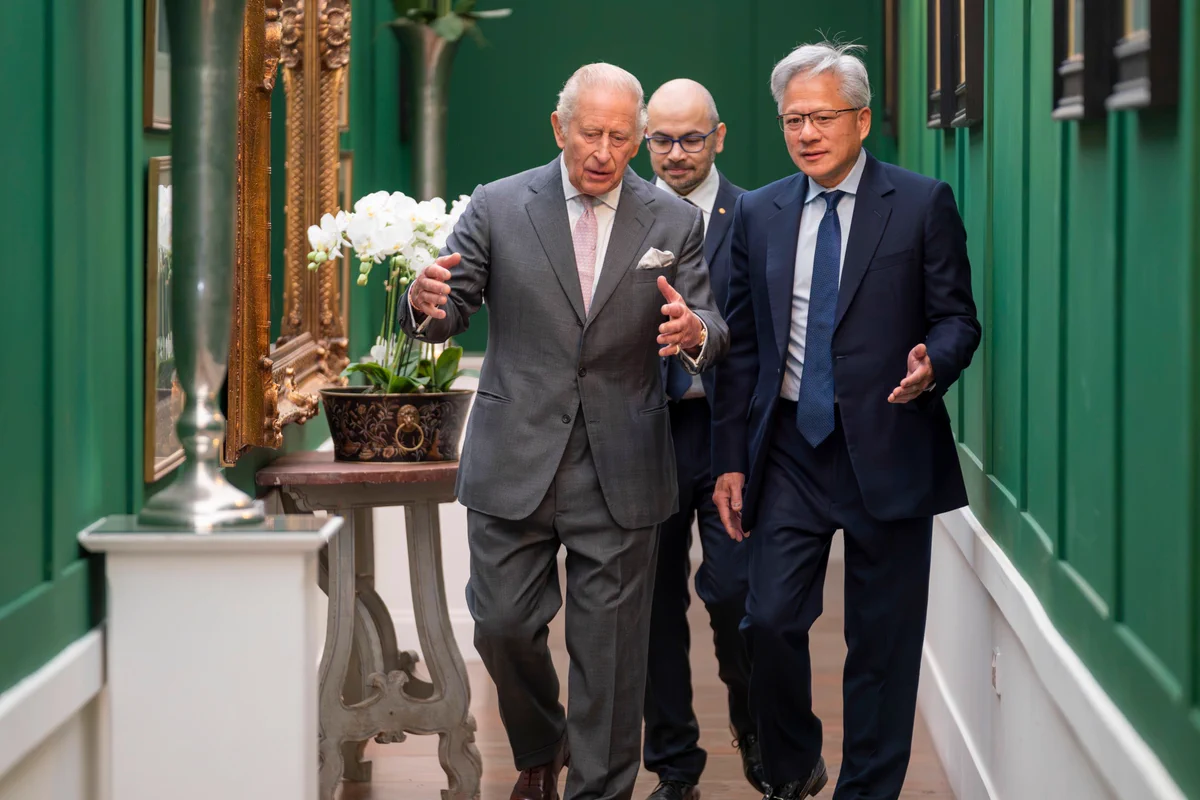 His Majesty King Charles III walks with NVIDIA CEO Jensen Huang.