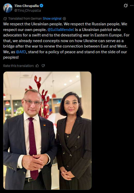 P_Kallioniemi's tweet photo. If Iuliia Mendel claims to be pro-Ukraine, why is she hanging out with Tino Chrupalla, who calls for an end on sanctions against Russia, refuses to call Putin a war criminal, blames NATO for the invasion and attends a Victory Day celebration at the Russian embassy? https://t.co/klNynnrHwQ