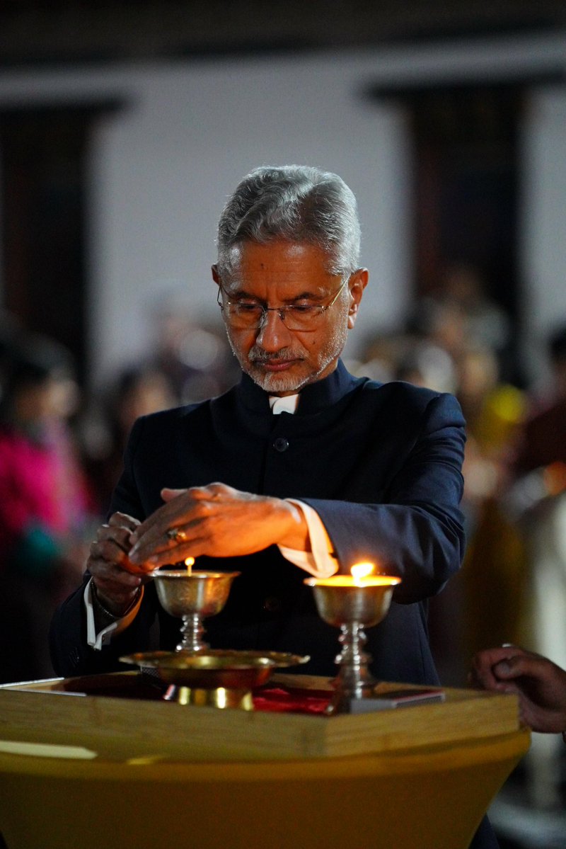 DrSJaishankar's tweet photo. The ‘Aashirvaad ka Diya’ was lit at the iconic Tashichho Dzong in Thimphu in the gracious presence of His Majesty The King Jigme Khesar Namgyel Wangchuck.

We paid tribute to Prime Minister @narendramodi’s 25 years of committed Janseva, which has impacted countless lives globally. 

We were joined by Prime Minister @tsheringtobgay, @FMBhutan D. N. Dhungyel, friends of India from Bhutan and the Indian community in this special moment.
