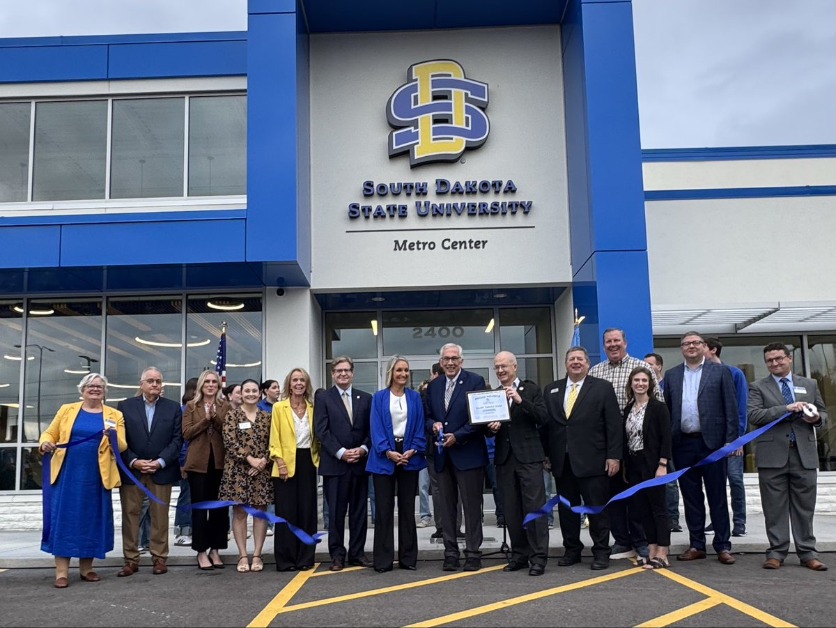 SDState's tweet photo. We cut the ribbon on the new SDSU Metro Center in Sioux Falls! 🎉🏫 The new facility brings five health programs and support services together under one roof, creating new opportunities for students and strengthening healthcare education across South Dakota. 🐰 #SDState https://t.co/RG3xMSx4mv