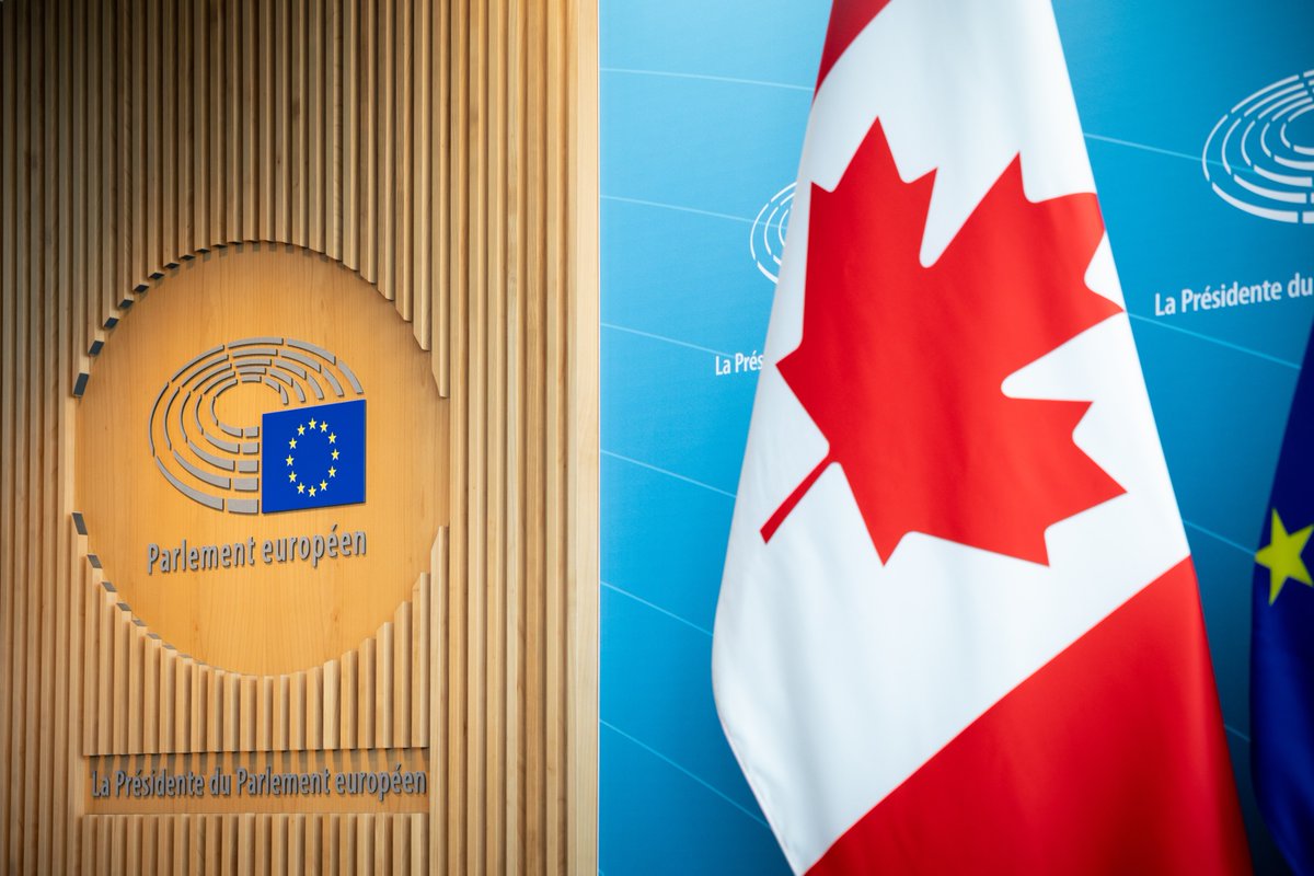 A Canada flag next to the European Parliament logo.