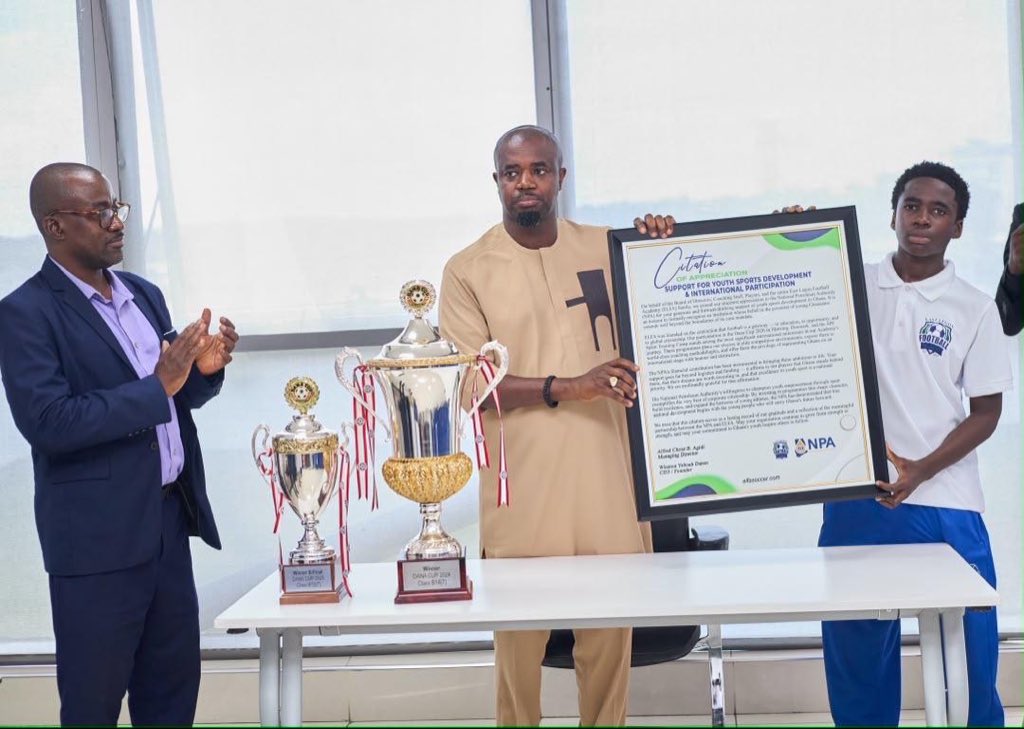 NPAGhana's tweet photo. East Legon Football Academy Commends NPA for Supporting Youth Development Through Football

The East Legon Football Academy has commended the National Petroleum Authority (NPA) for its support towards youth development through football.
This follows the Authority’s contribution to the Academy’s participation in international football competitions and development programmes in Denmark and Spain.

The support enabled the Academy’s young footballers to travel to Denmark to participate in the prestigious Dana Cup competition, where the team has competed for the past four years. 
The Academy has enjoyed notable success at the tournament, with its Under-14 boys’ team winning the trophy in 2024, followed by the U-12 boys’ team in 2025.

The young footballers also travelled to Spain for scout trials with Rush SPF Academy in Madrid. During their visit, the team toured the Santiago Bernabéu and Metropolitano Stadiums, home grounds of Real Madrid and Atlético Madrid respectively, and participated in training sessions with football academies in Spain.

The Academy expressed its appreciation to the NPA during a visit to the Authority to formally demonstrate its gratitude for the support earlier today.

The Chief Executive Officer of the NPA, Mr. Godwin Kudzo Tameklo, Esq., acknowledged the Academy’s achievements and commended the young footballers for their courage, discipline and commitment to pursuing excellence through football.

He noted that it was encouraging to see young footballers demonstrate the discipline and determination required to compete at the international level.

As a gesture of appreciation, the Academy presented the NPA CEO with a citation and a personalised football jersey in recognition of the Authority’s support and contribution to the development of young footballers in Ghana.

The NPA’s support for the East Legon Football Academy forms part of its commitment to contributing to national development through its Corporate Social Responsibility (CSR) activities.

Visit https://t.co/HDajXgfqeu for more updates.