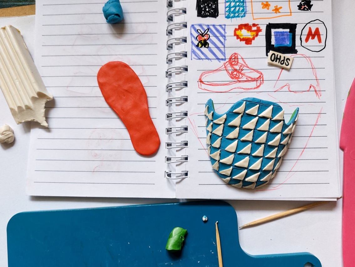 planetspho's tweet photo. It all starts with a sketch and hours of patience. 📜✍️Every single white triangle on that blue pattern was individually cut and placed using a toothpick.🪄 No 3D printers or digital scaling. Just high-precision plasticine work and a passion for retro gaming. 🍄🎮 https://t.co/tUfN4deKwH