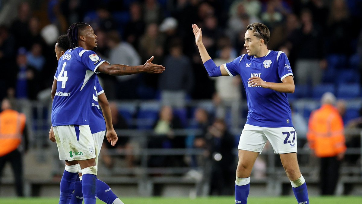 Joel Colwill is congratulated by Gabriel Osho after scoring for Cardiff City against Stoke City at the Cardiff City Stadium.