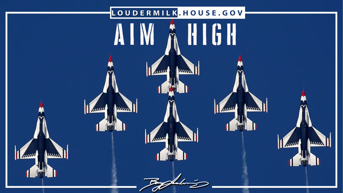 A blue poster featuring five fighter jets flying upward in formation, framed by a white border. There is large headline text near the top, a website address above it, and a signature-style mark at the bottom.