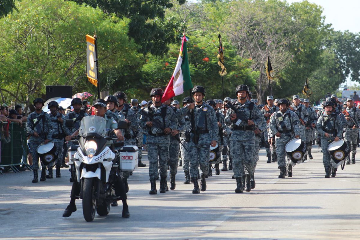 GNQRoo's tweet photo. Elementos de la Guardia Nacional participaron en los desfiles cívicos conmemorativos realizados en los 11 municipios de Quintana Roo, como parte de las actividades destinadas a preservar y fortalecer los valores cívicos, patrióticos y el respeto a los símbolos nacionales. https://t.co/FhrokKOhJG