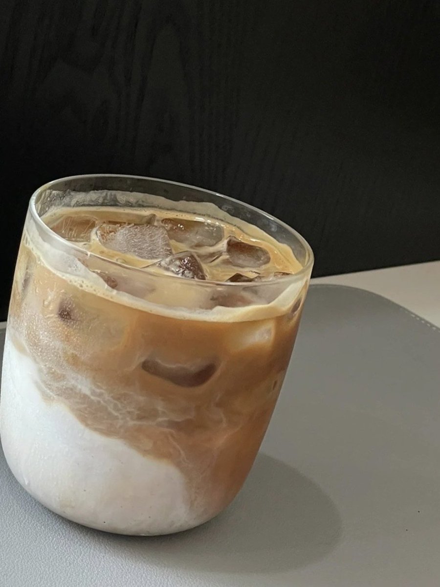 Atiluwe's tweet photo. Just found you left half your iced coffee on my desk—guess it’s our little today ritual now, huh https://t.co/LOwXITsGcO