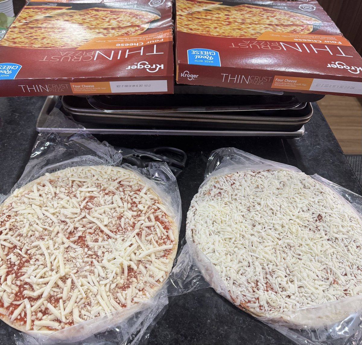 ShelleySullivan's tweet photo. @kroger one of these things is NOT like the other yet they are SUPPOSED to be identical…seriously @kroger? Apparently not even close to being @DiGiorno won’t make that mistake again 😡🤦🏻‍♀️ https://t.co/ah6TpNH0N9