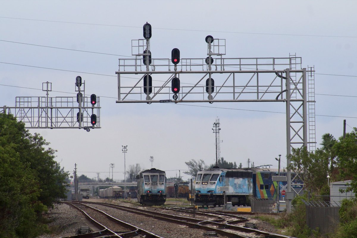 tommy4trains's tweet photo. Tri-Rail P30523 for Downtown Miami slips away from Hialeah Yard near Miami, Florida while P634X from Downtown holds clear inside the yard. My video of both of them and more: https://t.co/6cdbIYgh1f https://t.co/X3QyuydknM