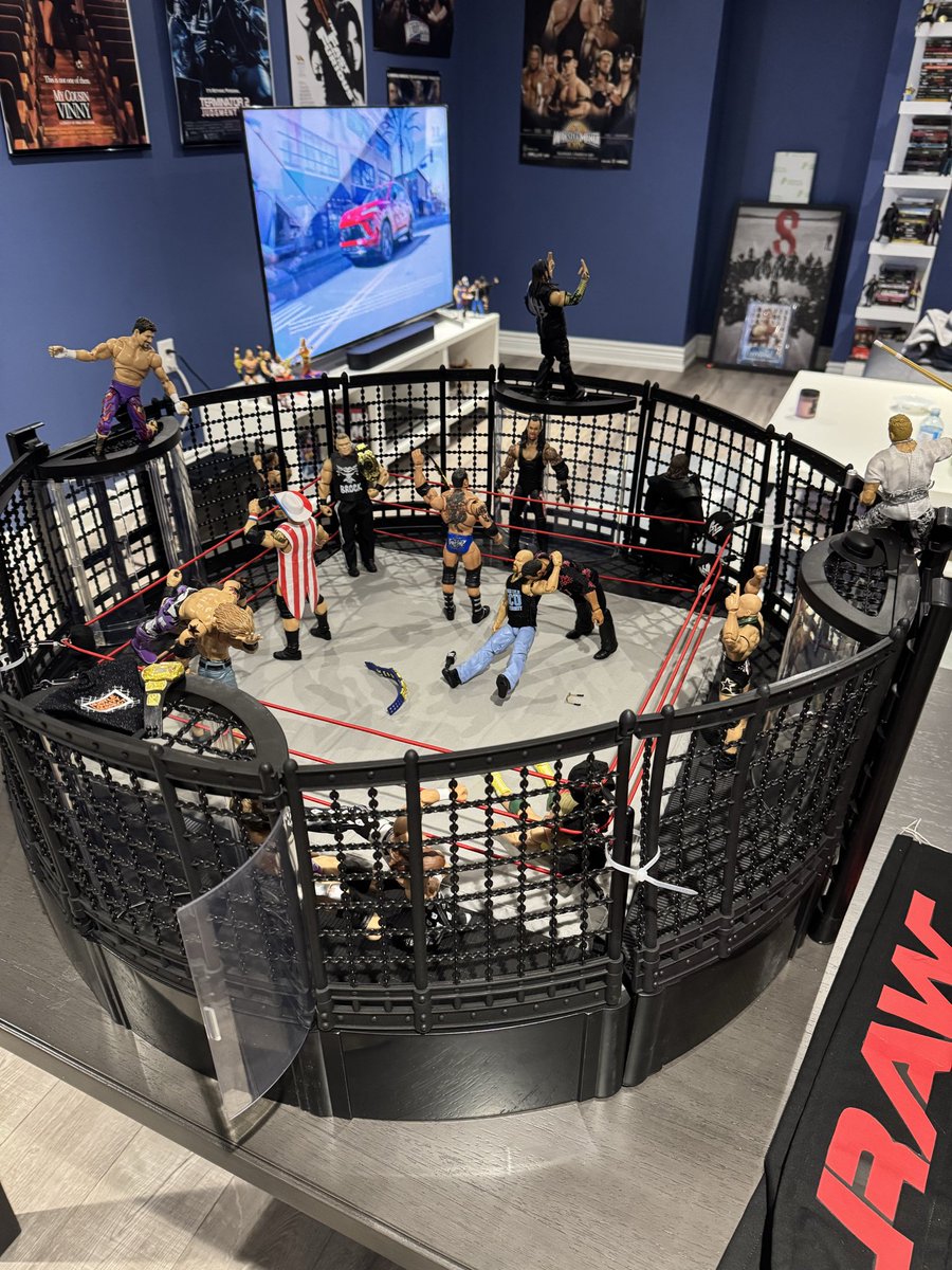 WrestlinGifs's tweet photo. ngl even all these months later I still feel like a kid seeing the chamber playset lol, 

best purchase ever 

here’s what’s going on these days in the man cave https://t.co/VC53uqYko5