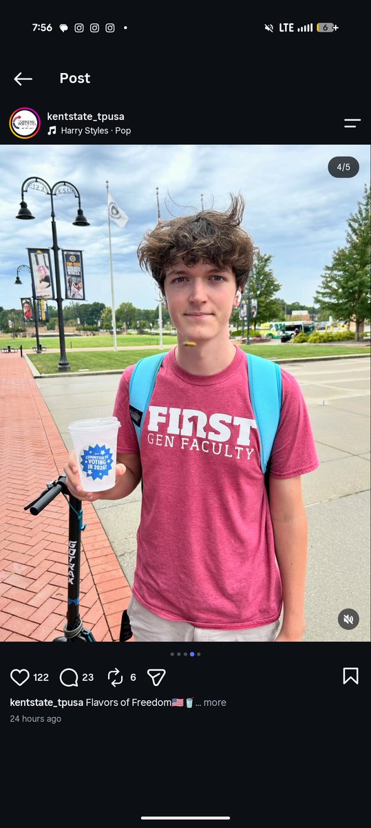 danielmustdiee's tweet photo. really infatuated by this picture that TPUSA posted on my college campus at the Charlie Kirk memorial where a bee flies by someone's neck exactly when the photo was taken and looks like a bullet https://t.co/tCdPhvEGH2