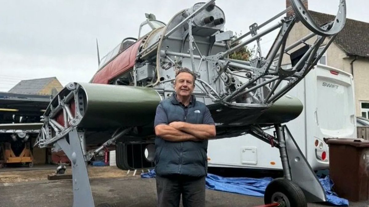 Goodable's tweet photo. Most people park a car in their driveway. 

Julian has a WWII fighter plane.

He's spent 6 years restoring the 1941 Hawker Hurricane, using the original drawings and manuals.

His goal? Get it flying again. ✈️

Here's his amazing story: https://t.co/BbHFeZuBGe https://t.co/ve0MFKx14S