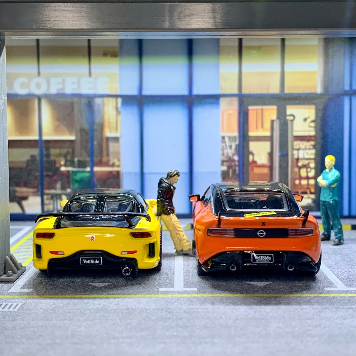 ArethaKitcxbx's tweet photo. POV: You came for coffee… and it turned into a street meet. Which build wins: orange widebody or yellow track spec? Rate both 1–10. Note: This isn’t an ad. Everything is from my own collection. https://t.co/82EHAcehll