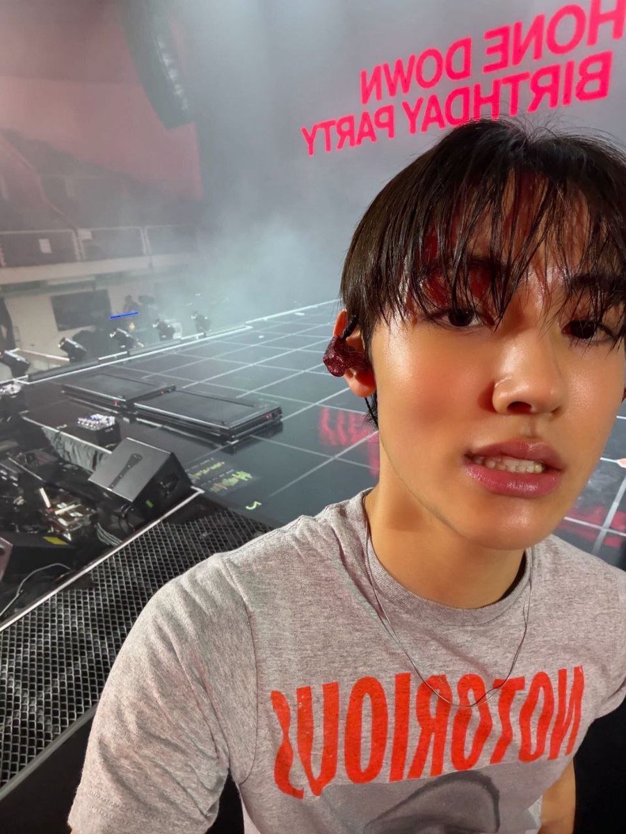 seonghyone's tweet photo. Backstage felt like its own little world, so I had to steal a frame before everything kicked off. Hair all over the place, in-ear on, stage behind me—I looked a little too ready for whatever came next. https://t.co/lwtdtLwn6N