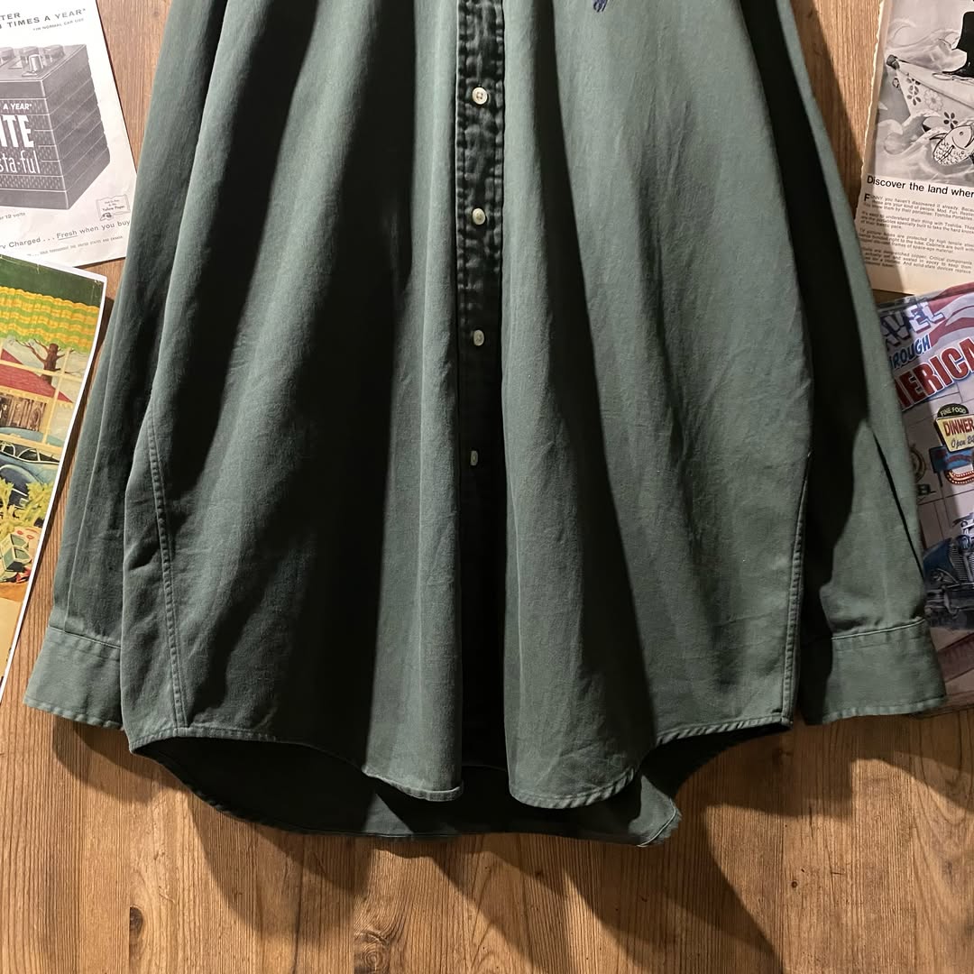 DevinDoryd8's tweet photo. Ralph Lauren button-down shirt in khaki. Its muted color and vintage feel stand out, while the navy pony logo adds a refined touch. Style it formally or casually, and have fun accessorizing this classic piece. https://t.co/KlcXpEfQOA