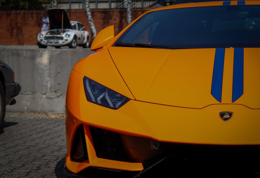 BretEarhart's tweet photo. Orange with a racing edge. The Lamborghini Huracán Tecnica perfectly balances road car and track weapon, with aggressive aero, a naturally aspirated V10, and one of the cleanest Huracán designs ever. Would you choose it over an STO? https://t.co/g00dMoTUUO