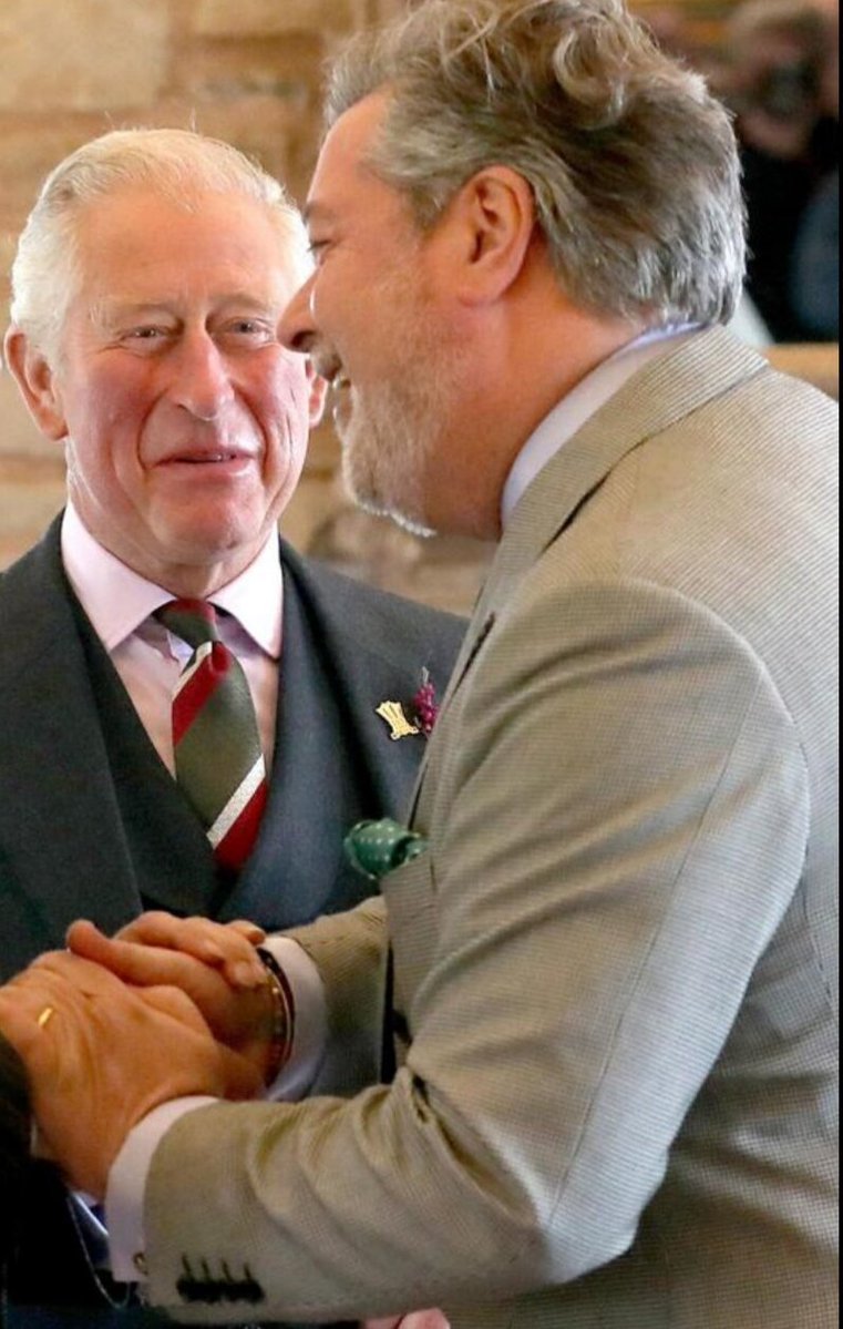ShakeLS's tweet photo. King Charles alleged male lover Michael Fawcett, let's talk about him a bit. 

He started out as a low grade servant, has no education whatsoever. He was a servant to Prince Charles along with Paul Burrell. He was cunning and calculative, made sure to get to Charles good graces by telling on other servants and spying on Princess Diana. Their relationship became so close that he apparently would be squeezing Prince Charles toothpaste in the Morning, would be the one responsible for Charles hygiene. His name came to prominence when after Diana's death in her death inquest when asked if Princess Diana had kept secret recordings her sisters told the judge that Princess Diana had tapes and recordings, but they didn't know their whereabouts. The press named Michael Fawcett as part of those recordings in connection to another servant. They wouldn't post the whole story because suddenly a super injunction happened from the palace. Apparently Princess Diana recorded a servant telling her that Michael Fawcett repeatedly drugged him and raped him. Charles became aware of it and send that servant to the priory. He committed suicide afterwards. Princess Diana despised Fawcett and after the separation she demanded he would never be alone with her sons. 

After the separation Paul Burrell went with her and Fawcett went with Charles. That was it. He controlled everything that had to do with Charles program, social life. Hr became absolutely powerful and started working for the Princes Trust. Another servant reported him to the police for bullying and racism but quickly took that report back, was fired. 
Two people who donated jewelry to the prince trust find out they were sold for cash. They reported it to the police and it went back to Fawcett. Then the Royals household started an investigation that proved he was frequently getting the gifts, selling them. Then Charles again protected him telling the investigation he told Fawcett he could take the gifts.

As a result he was let off. And what happened next? Fawcett created his own PR company and was hired from Charles. He then became director of the Prince Foundation. A few years after that, pretty recent he was caught getting millions on suitcases apparently for "charity". He was immediately fired. But he remains Charles closest person and confidant living and travelling with him.