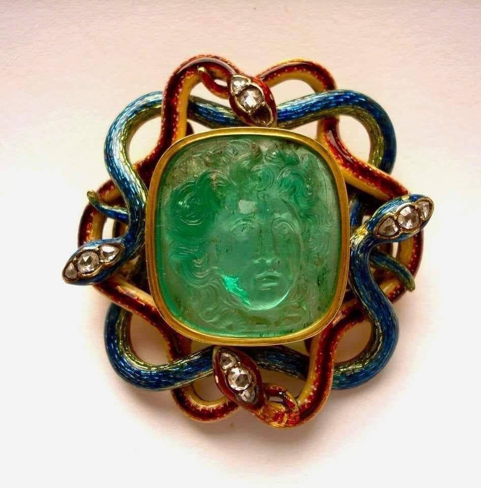 Odd_Vision1's tweet photo. He didn’t find the cursed pendant… the pendant found him.🐍🦁🔮

The antique pendant was discovered inside a locked box beneath an abandoned mansion. Its green stone carried the face of a lion surrounded by twisted serpents.

That night, Daniel placed it on his desk.

At exactly midnight, the pendant began glowing.

He heard a voice whisper from the television screen: “Put it on.”

Daniel refused.

Then the screen showed his bedroom—but from behind him.

Someone was sitting in the chair.

He turned around.

Nobody was there.

When he looked back at the screen, the mysterious figure was wearing the pendant.

Daniel slowly touched his neck.

The pendant was already there.

And something whispered, “Welcome back.”🕯️