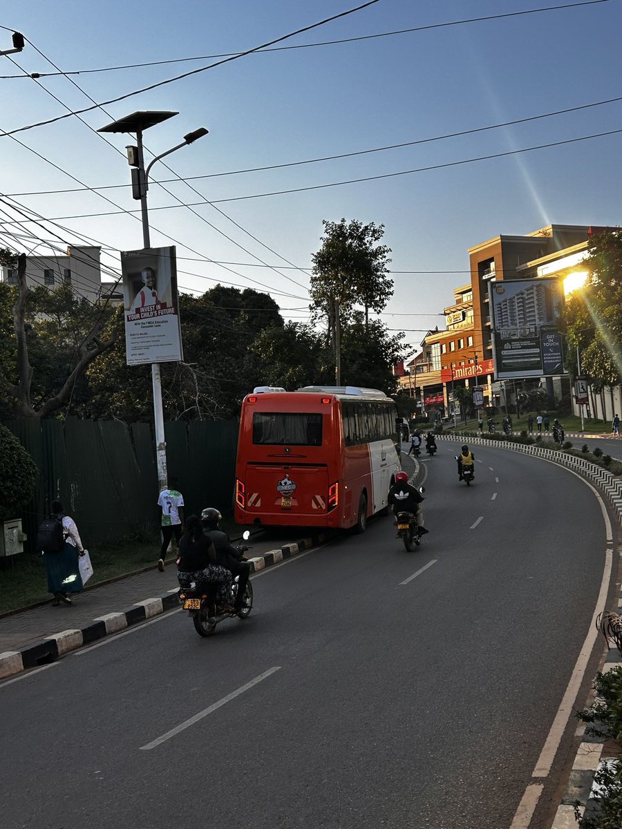 Akeda4's tweet photo. POOR TRAINING OR IMPUNITY‼️

At first I thought this @Nec_Fc Bus had broken down on Acacia Avenue and was temporarily pushed unto the walkway. 

I was wrong. Looks like it’s their sweet parking spot and drives off in the evening. 

While @KCCAUG works hard to create safe walkways, someone thinks it’s a parking spot.

Why?

Please STOP abusing and DAMAGING walkways, you’re compromising pedestrians’ SAFETY. 

Think SAFETY FIRST.

#SafeRoadsSaveLives