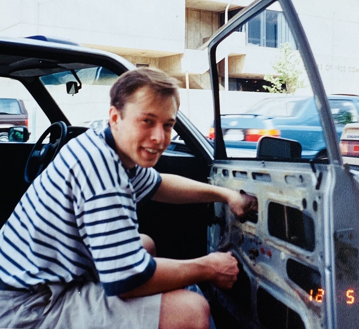 astro_greek's tweet photo. Elon could not pay a shop to fix the car.

He pulled parts from a junkyard and did it himself.

Years later he is in a photo replacing a broken side window and laughing that the circle closed.

The first version of the factory habit is a broke kid with a screwdriver.

If you cannot buy the fix you become the fix.