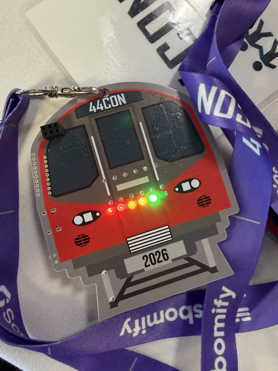 44CON's tweet photo. The #44CON 2026 badge is a Meshtastic mesh networking device shaped like a London tube, with a built-in CTF. 🚊 

20 flags.
Hidden cipher boxes around the venue. LEDs that unlock animations as you solve them.

A huge thanks to Eduardo + the @electronicats team 🐱 https://t.co/LiIdrQJxMv