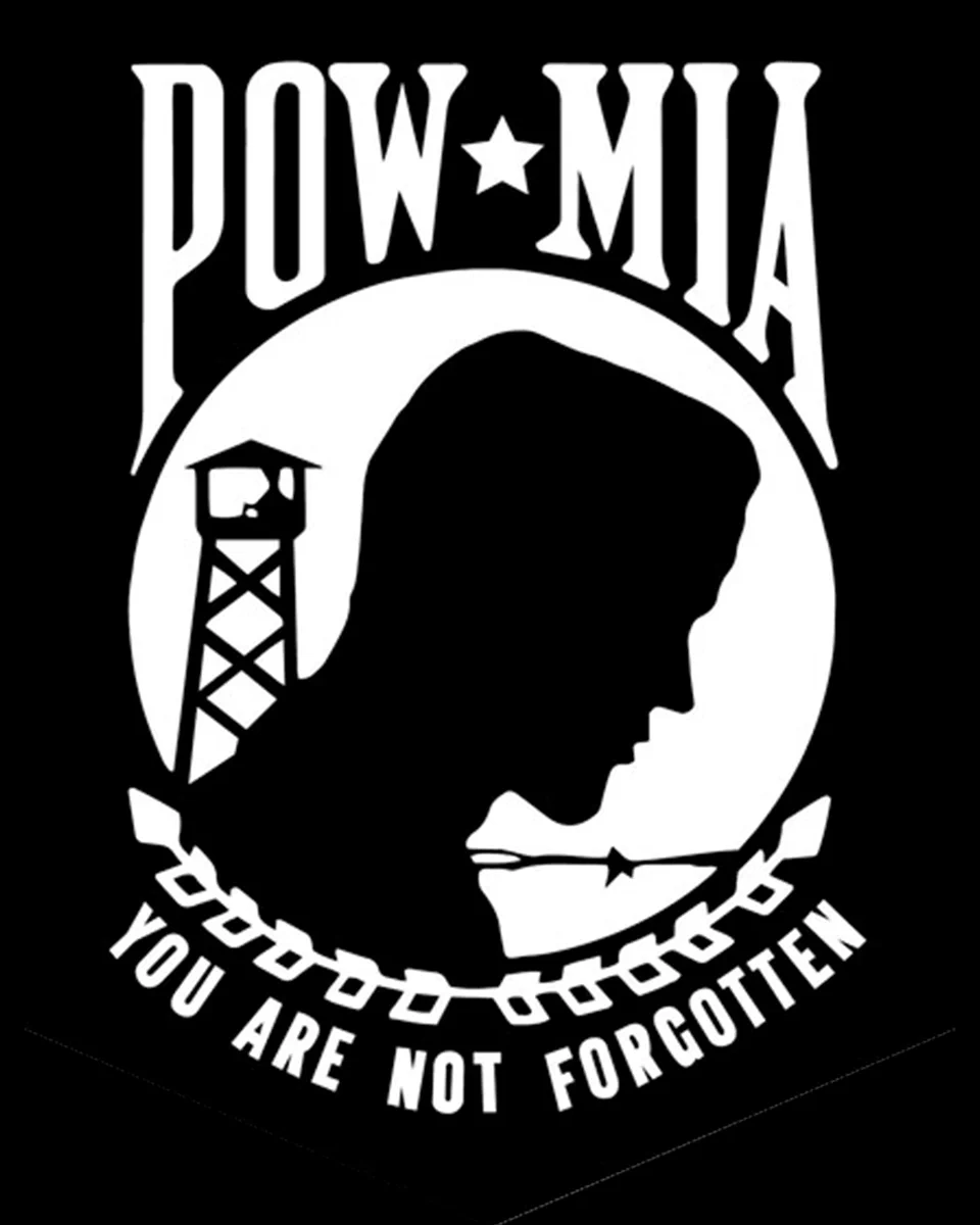 Silhouette of a soldier's head with a guard tower and barbed wire, captioned POW*MIA and You Are Not Forgotten.