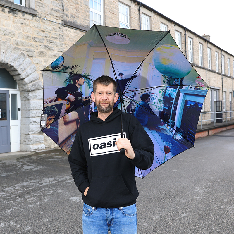 MicrodotCreativ's tweet photo. Style guru Microdot product manager Lee seen modelling the new in official Oasis merchandise ‘Logo hoody’ featuring the classic Oasis logo designed by us here at Microdot in 1994. 
Also Def Maybe &amp; Morning Glory golf brollies - I have signed each one!
https://t.co/8DwwYUOgqj https://t.co/mWL3qnpscL