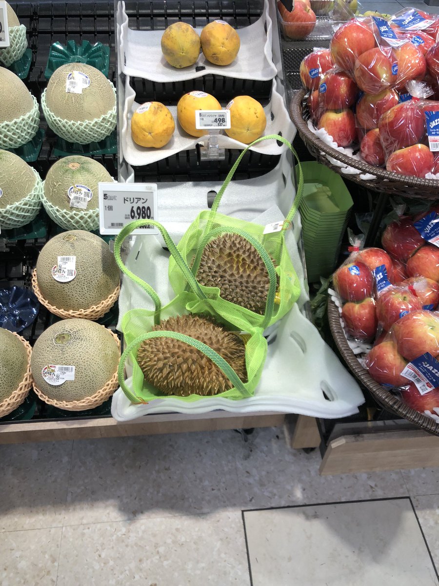Whatshims's tweet photo. They are selling durian at our local supermarket and it’s making the whole fruit section stink!! No wonder why hotels ban these in Southeast Asia haha. https://t.co/kdi3QjxyHc