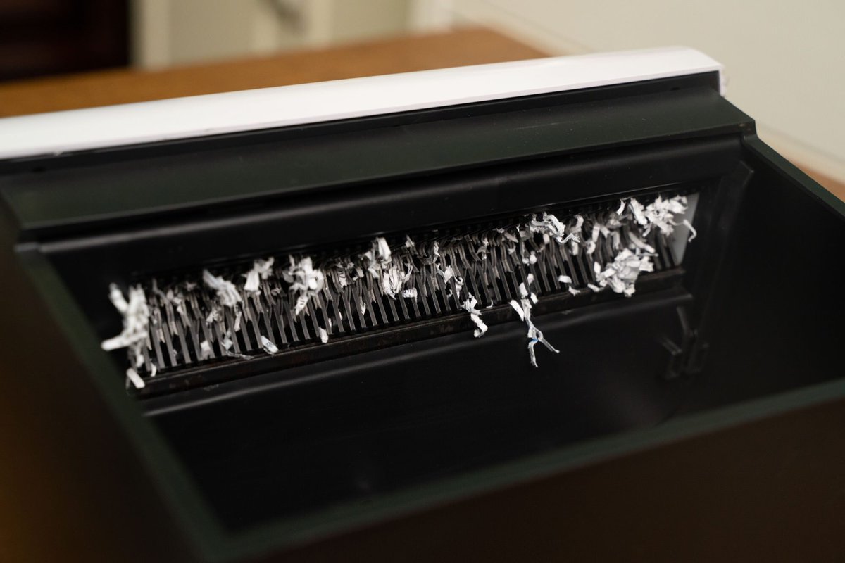 SuzyBrinkman's tweet photo. My coworker tried to use our office's new "smart" paper shredder for 10 mins before realizing it only eats plastic—not her half-eaten lunch. https://t.co/RoHYevMejj