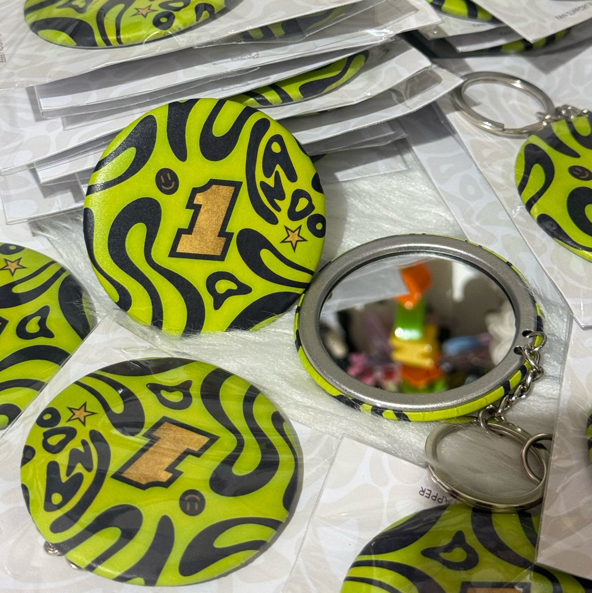 landoyapper's tweet photo. who’s going to the bahrain/ sepang and sg gp? im giving away 100+ lando pocket mirror keychain freebies! hmu and see you all there 💚 https://t.co/pV0FSxCMFB