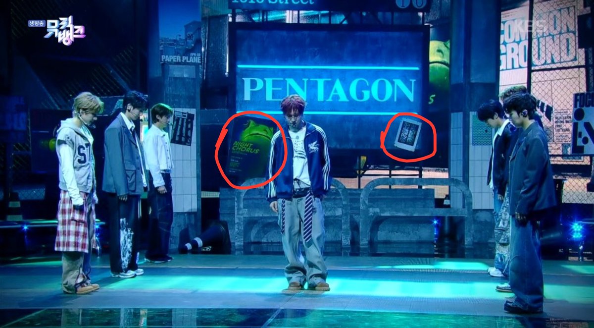 ptgshinee's tweet photo. so many details in today's stage. the paper plane (shine), the frog (naughty boy), the apple (like this), the pavement (runaway), the mosaic (sha la la), the 1010 street, the "pentagon universe" sign, etc. 🥹 https://t.co/WSKcM0CdNi