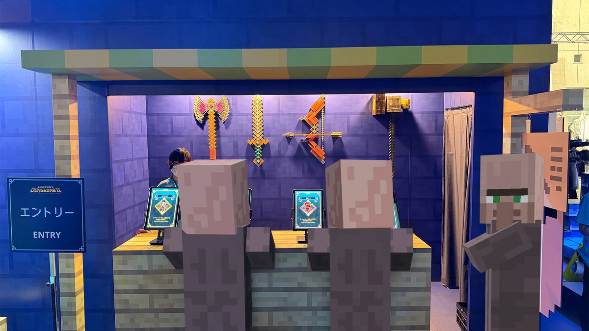 東京ゲームショウのマインクラフトブースに合成のマインクラフトの村人が並んでいる画像。