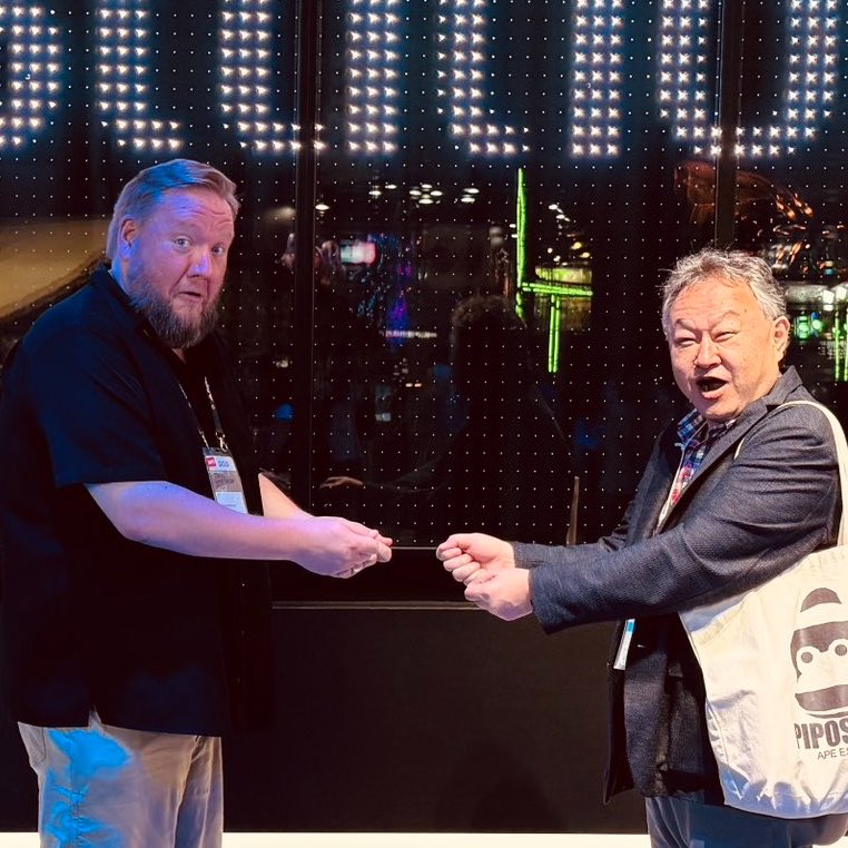 DoesItPlay1's tweet photo. This picture of Shuhei Yoshida and Adam Boyes from Tokyo Game Show is making the rounds. Seemingly mocking current anti-consumer PlayStation for killing the philosophy behind their once famous pro-consumer mockery of Xbox regarding physical game sharing. https://t.co/xexZmjKpm2