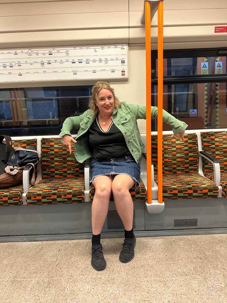 Me on the train in a light green denim jacket