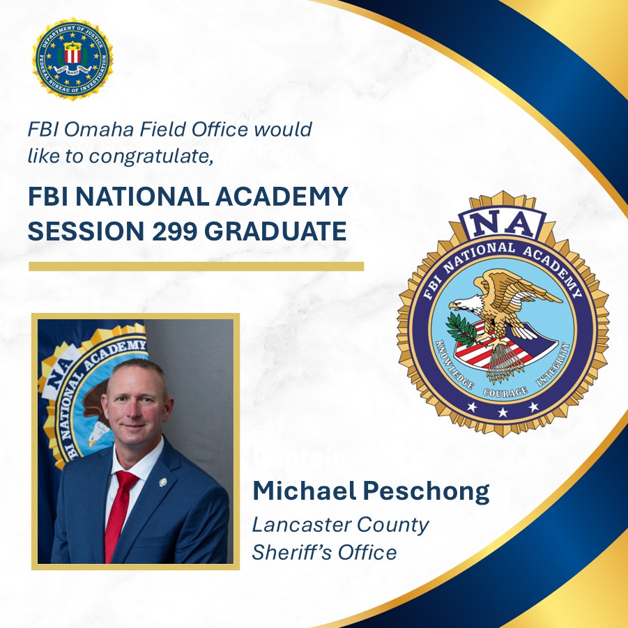 Portrait of Michael Peschong in a suit with FBI National Academy emblem, congratulated as Session 299 graduate by FBI Omaha Field Office.