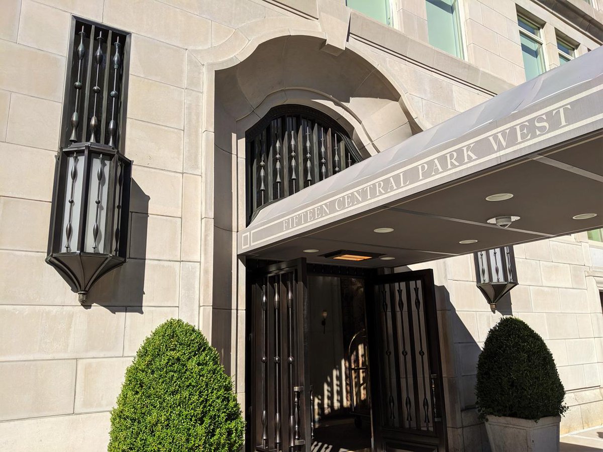 CrenshawLight's tweet photo. Custom exterior sconces at 15 Central Park West in New York. A pair of lanterns flanking the arched entry, finished to match the metalwork of the door. First impressions run through fixtures like this — designed, engineered, and fabricated in our shop. https://t.co/6OdZacbmQO