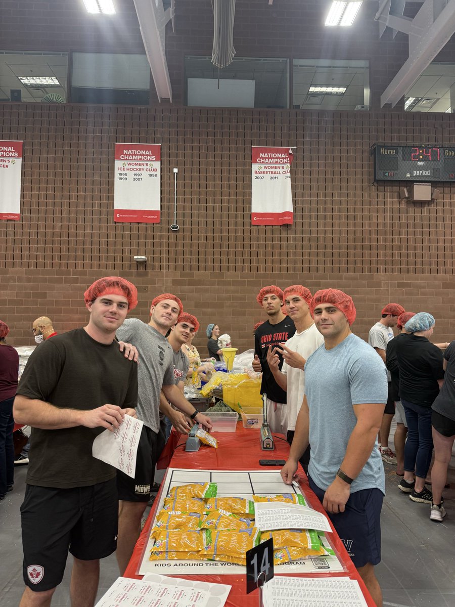 Teammates packing food