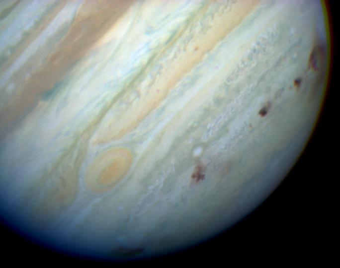 DJSnM's tweet photo. This is comet Shoemaker-Levy 9 - in 1994 its 21 fragments smashed into Jupiter over a week.
Except it's not really a comet, spectroscopic observations found no gas, the coma was entirely made of dust.
Usually comets heat up near the sun, emit gas and the gas releases dust, but SL9 wasn't doing this, instead it had been torn apart by tidal forces near jupiter, and those dust clouds were released by this process.

It's no more a comet than Dimorphos was after it was hit by DART.