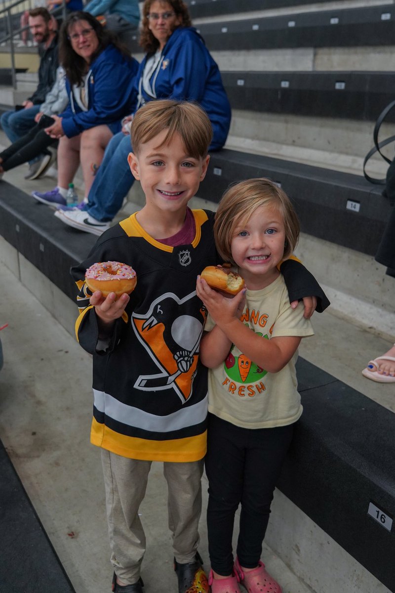Photo of young fans with donuts.