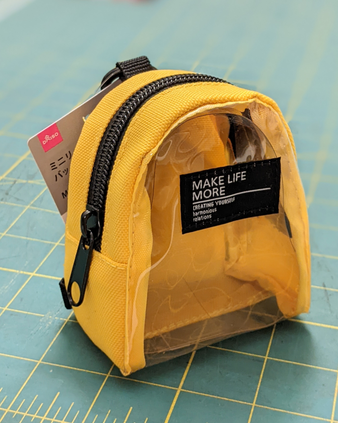 KiRAWRart's tweet photo. Found this tiny yellow backpack at Daiso and got an idea https://t.co/nkbmwo4DxT